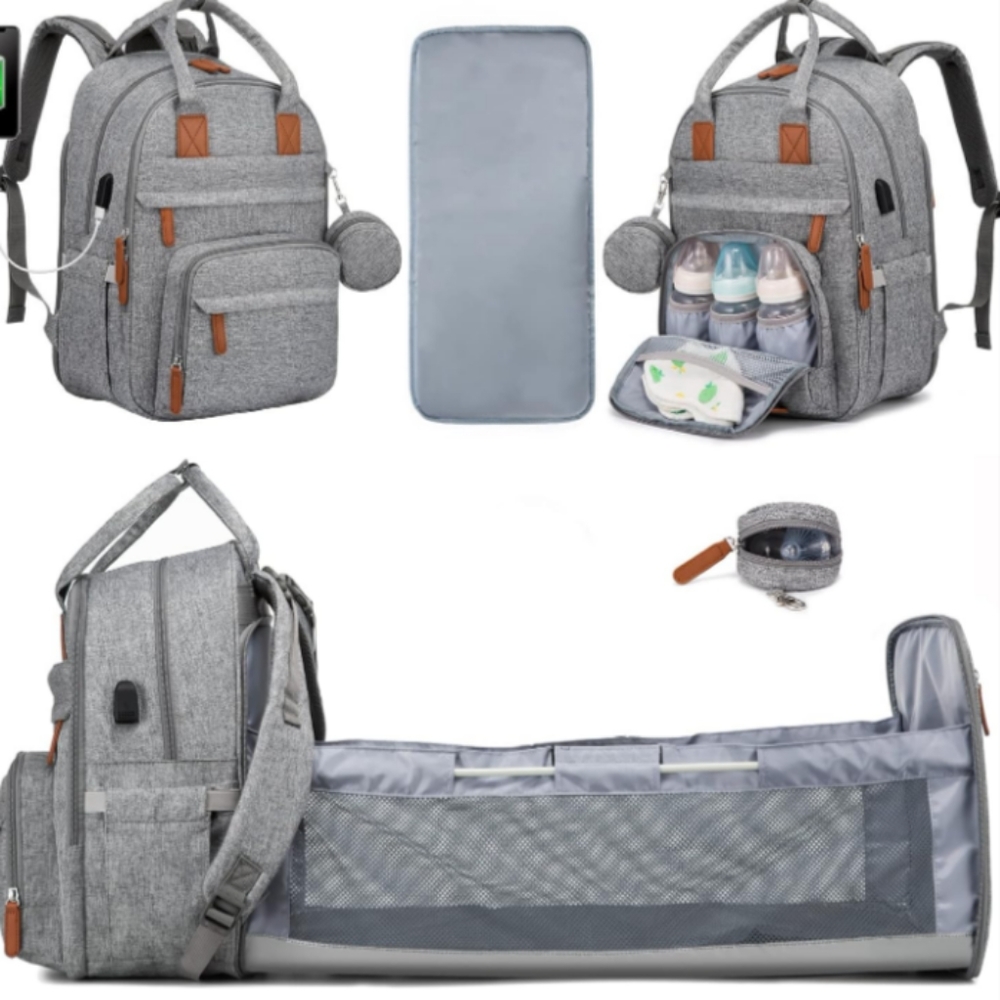 Diaper bag with portable changing station